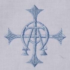 the cross is made out of blue thread and has an intricate design on it's side