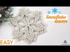 an ornament made out of yarn with snowflake