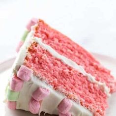 a slice of pink cake with marshmallows on it