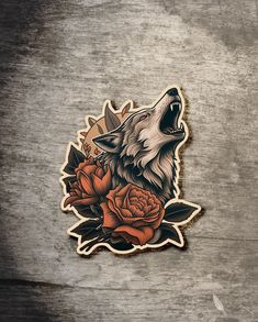 a sticker with an image of a wolf and roses