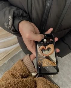 a person taking a photo with their cell phone