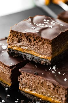 several pieces of chocolate cake sitting on top of each other