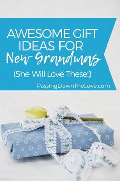 blue gift box with ribbon and flowers on it that says, awesome gift ideas for new grandmas she will love these