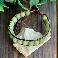 This green Jade bracelet would make the perfect gift for someone special to you or yourself. Green Jade is said to bless whatever it touches. It is also known as the crystal of love. It is said to be supportive of new love, and has been said to increase trustworthiness and fidelity. This bracelet would make the perfect couples gift. The bracelets can be made in a variety of lengths to fit men and women. Faceted Beads Bracelets As May Birthstone Gift, Faceted Beads Bracelet For May Birthstone Gift, May Birthstone Bracelets With Faceted Beads As Gift, Green Adjustable Wrap Bracelet As Gift, Spiritual Faceted Beads Wrap Bracelet As Gift, Spiritual Wrap Bracelet With Faceted Beads As Gift, Green Hand Wrapped Spiritual Bracelets, Green Wrap Bracelet With Round Beads As Gift, Green Wrap Bracelet With Round Beads For Gift