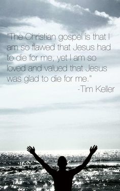 a man standing on top of a beach next to the ocean with his hands in the air