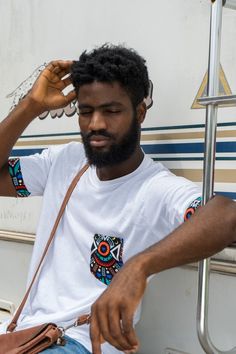 Our African Tribal Print Unisex T-shirt is great for an everyday look.⠀Whether you are looking to go casual, elegant or just basic.⠀The fabric of this shirt has a soft feel, with colourful and bold tribal prints details as the pocket and the arms.Makes it one to fall in love with - over and over again.⠀It is lightweight and can be styled with jeans to create a relaxed, yet trendy outfit.⠀This T-shirt is a very great gift idea⠀This T-shirt design comes in all sizes⠀100% Soft Cotton (fibre content Casual Cotton Festival T-shirt, Casual White Top For Festival, White Relaxed Fit T-shirt For Festival, White Short Sleeve T-shirt For Festivals, Men Gift Ideas, African Print Shirt, African Dresses Men, African Shirts For Men, Tshirt Printing