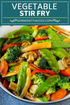 vegetable stir fry with broccoli, carrots and peppers in a white bowl