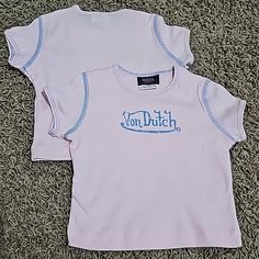 New Without Tags Von Dutch Graphic T-Shirt. Size 24 Months Baby/Kids/Toddler Tee With Incredible Amount Of Stretch. Kustommade Von Dutch Originals. Pink With Blue Graphic And Contrast Stitching Detail. 100% Cotton. Made In U.S.A. Machine Washable. Super Comfy, Super Cute Top. Several Other Sizes And Styles Of Von Dutch Tops In My Store. Smoke Free And Pet Free Home. Please Check Out My Other Items...I'd Love To Make A Discounted Bundle For You. Thank You!! Von Dutch Top, Pleated Jacket, Von Dutch, Blue Graphic, Yellow T Shirt, Toddler Tees, Knitted Tshirt, Cute Top, Blue T