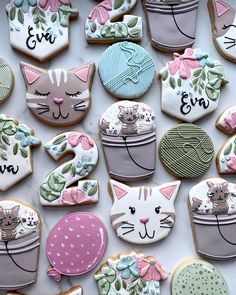 some decorated cookies are laying on a table