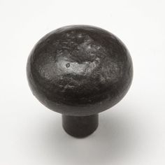 an old black knob on a white background