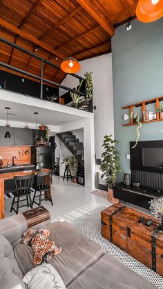 a living room filled with furniture and a flat screen tv