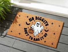 a door mat that says no diggitt but to bag it up with a ghost holding a pumpkin