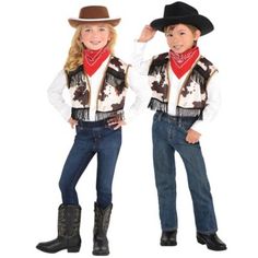 two children wearing cowboy outfits and hats