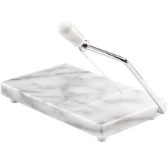 a white marble serving tray with tongs on the top and one in the middle