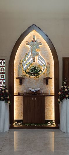 the interior of a church decorated with flowers and decorations on it's altar area