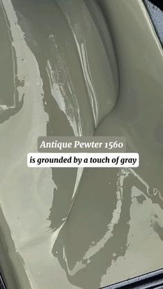 an antique pewer is grouted by a touch of gray text reads, antique pewer 156