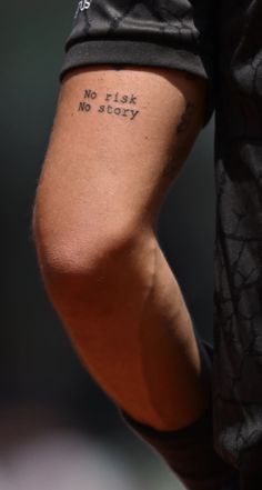 a close up of a person's arm with the words no task, no story written on it