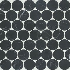 a black and white tile with circles on it