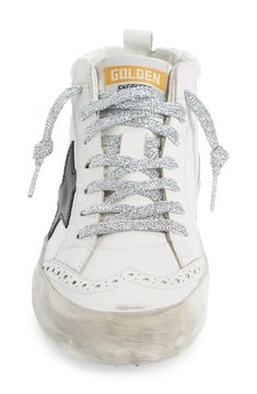 Signature scuffed-up detailing accentuates the sparkly laces of a leather sneaker punctuated with perforated eyelets. Lace-up style Leather upper and lining/rubber sole Made in Italy Women's Designer Shoes Silver High-top Sneakers With Perforations, Silver Lace-up High-top Sneakers, Silver High-top Sneakers With Laces, Lace-up High-top Sneakers With Perforations, Silver Low-top Custom Sneakers With Laces, Silver Low-top Custom Sneakers, Golden Goose Mid Star, Golden Goose Mid, Star Sneakers