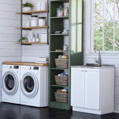 a washer and dryer sitting next to each other in a room