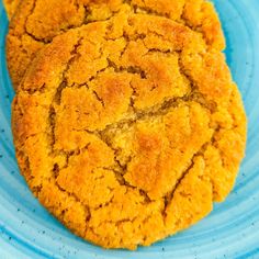 two cookies are on a blue plate next to each other