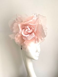 Large soft pink flower hat This amazing large pink flower hat is made from organza and velvet fabric. The hat sits on the black 10cm sinamay base which is attached to a fabric-covered headband and a comb so it will sit steadily on your hair. A large Pink flower hat will be an amazing accessory to compliment your outfit. It will fit the average head size. You can wear this amazing hat at weddings, Christenings, Horse races, and any other special occasion. Enjoy and please have a look in my shop f Whimsical Pink Headpiece With Handmade Flowers, Pink Flower Headpiece For Wedding, Pink Flower Headpieces For Wedding, Pink Pinched Crown Headpiece For Races, Pink Flower Fascinator For Wedding, Pink Feminine Fascinator For Wedding, Pink Handmade Flower Headpieces For Royal Ascot, Pink Headpieces With Handmade Flowers For Royal Ascot, Pink Feminine Fascinator For Evening