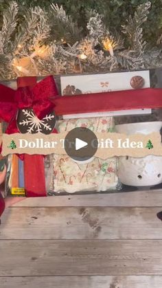 the holiday presents are on display in front of a christmas tree with red ribbon and snowflakes