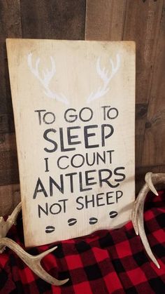 a sign that says to go to sleep i count antlers not sheep on it