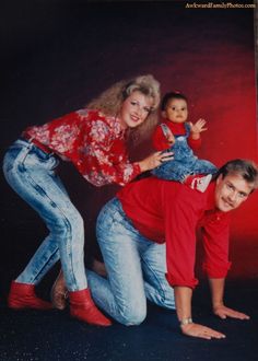 an old photo of three people posing for a picture with a doll on their lap