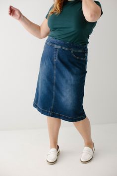 Simple lines, classic and comfortable, the 'Sara' is everything a denim skirt should be. This skirt is made from a quality stretch denim and is as comfy as they come! The classic dark wash pairs well with everything from a timeless button down to a graphic tee. Featuring a wide waistband for extra comfort and ease of styling. Exclusively designed by us for you. 97% Cotton 3% Spandex Machine Wash Cold Do Not Bleach Hang to Dry Low Iron if Needed Do Not Dry Clean Functional Back Pockets Available Dark Wash Stretch Denim Mid-rise Skirt, Mid-rise Stretch Dark Wash Denim Skirt, Stretch Mid-rise Dark Wash Denim Skirt, Dark Wash Relaxed Denim Skirt, Everyday Dark Wash Denim Skirt, Fitted Dark Wash Denim Skirt For Everyday, Casual Dark Wash Lined Denim Skirt, Medium Wash Stretch Denim Skirt, Dark Wash Stretch Mid-rise Skirt