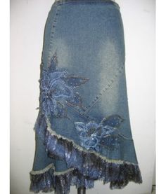 a denim skirt with fringes and flowers on it