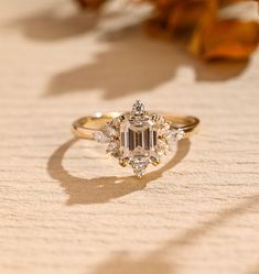 a diamond ring sitting on top of a table