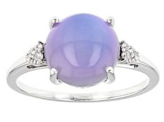 10mm Purple Aurora Moonstone With .04ctw Round White Zircon Rhodium Over Sterling Silver Ring. Measures approximately .60"L x .39"W. Not sizeable. Finished under gallery. Accent stones primarily zircon. Fine Jewelry Round Ring With Gemstone Accents, Fine Jewelry Diamond Ring With Gemstone Accents, Diamond Birthstone Ring With Gemstone Accents, White Gold Diamond Ring With Gemstone Accents, Silver Opal Ring With Diamond Accents, Moonstone Ring With Diamond And Gemstone Accents, Formal Moonstone Ring With Gemstone Accents, White Gold Birthstone Ring With Gemstone Accents, White Gold Round Cabochon Gemstones