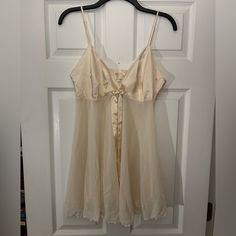 Brand: Victoria’s Secret Size: Medium Material: 100% Polyester Color: Cream Condition: Never Worn - Great Condition Sheer Cream Nightgown For Sleep, Cream Sheer Nightgown For Sleep, White Spring Chemise For Night, White Spring Chemise For Night Wear, Victoria's Secret Sheer Nightgown For Loungewear, Sheer Victoria's Secret Nightgown For Bedtime, White Coquette Nightgown For Spring, Coquette White Nightgown For Spring, Cream Sleeveless Sheer Sleepwear