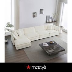 a large white couch sitting in a living room