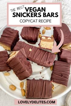 the best vegan snickkers bars copycat recipe on a white plate with almonds