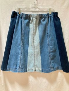 "This is a one of a kind homemade denim blue jean leg panel skirt. I used the bottoms from 3 pairs of cotton jeans in different washes, light, medium and dark, reworking them and upcycling them making an eight section paneled skirt in 3 tones.  I washed the jeans in fragrance free soap before working with them. I cut eight panels from the legs, flaring them out slightly at the hem. I kept the jean hems intact for their style and character. The seams are done with a serger so they won't unravel. Denim Blue Patchwork Denim Skirt, Casual Denim Patchwork Skirt, Blue Recycled Denim Skirt For Spring, Spring Blue Recycled Denim Skirt, Casual Dark Wash Patchwork Denim Skirt, Casual Blue Recycled Denim Skirt, Blue Denim Relaxed Fit Skirt, Denim Blue Recycled Denim Skirt With Pockets, Blue Recycled Denim Skirt For Summer