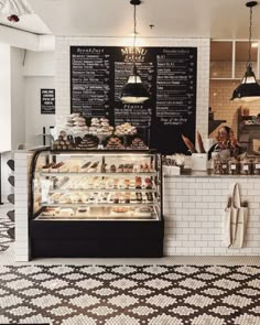 the inside of a bakery with lots of pastries on display