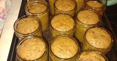 several jars filled with food sitting on top of a stove