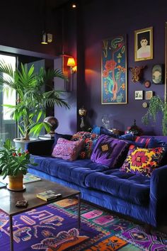 a living room filled with purple couches and colorful rugs