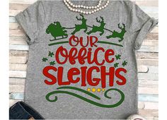 a t - shirt that says our office sleighs on it with santa's sleigh