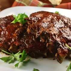 a close up of meat on a plate with parsley