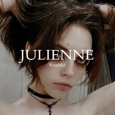 a young woman wearing a choker with the words julienne in front of her