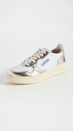 Autry Medalist Low Sneakers | Shopbop Sneakers With Leather Sole And Round Toe, Leather Sole Sneakers With Round Toe And Medium Fit, Luxury Lace-up Sneakers With Removable Insole, Classic Sneakers With Contrast Sole, Classic Closed Toe Sneakers With Branded Insole, Classic Flat Heel Sneakers With Removable Insole, Autry Sneakers Outfit, Autry Shoes, Everyday Sneakers