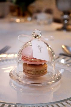 a glass plate topped with cookies covered in frosting