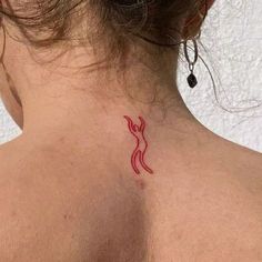 a woman with a red tattoo on her back