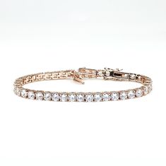 Juliette Clear 4.7mm Round 20ct Cubic Zirconia Rose Gold Tennis Bracelet This classic piece is perfect for a night out beau. A tennis style created with 4.7mm round cubic zirconia, hand prong set on rose goldtone plate with box clasp closure. The most amazing part of this 7in bracelet comes with 1in extender to makes it a continuous 8in bracelet. A gorgeous 10 carat clear cubic zirconia, handmade prong set on a lustrous rose goldtone plated finish with box clasp closure. Only the best quality cu Dazzling Rose Gold Tennis Bracelet With Cubic Zirconia, Dazzling Rose Gold Cubic Zirconia Tennis Bracelet, Adjustable Rose Gold Tennis Bracelet For Wedding, Rose Gold Hand Set Tennis Bracelet For Wedding, Rose Gold Tennis Bracelet With Cubic Zirconia, Rose Gold Round Diamond Bracelet For Wedding, Rose Gold Diamond Bracelet For Wedding, Rose Gold Cubic Zirconia Bracelets With Prong Setting, Rose Gold Jubilee Tennis Bracelet For Wedding