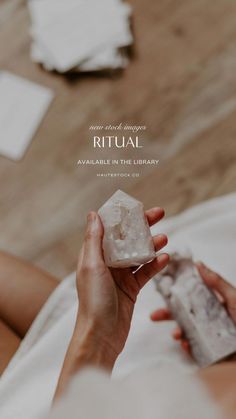 a woman holding a rock in her hand with the caption ritual available in the library