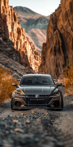 a car is parked on the side of a mountain road