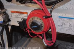 a red hose connected to an electrical device